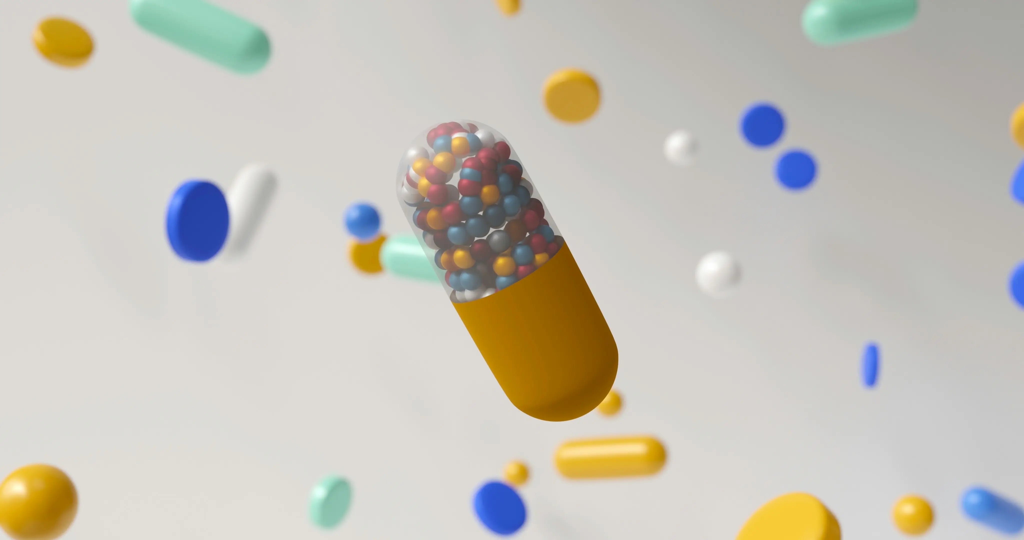 A close-up of a golden supplement capsule cut in half, releasing tiny multicolored beads into the air, surrounded by floating tablets and softgels—symbolizing resveratrol, trans-resveratrol, and pterostilbene options and their synergy with NMN.
